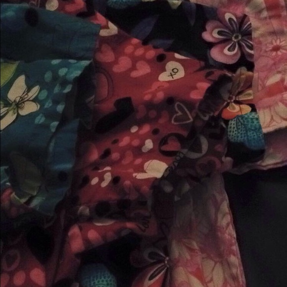 Scrub top bundle. Four like new scrub tops.
