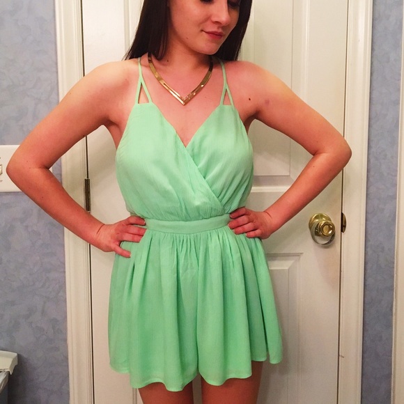 A mint colored romper by Honey Punch