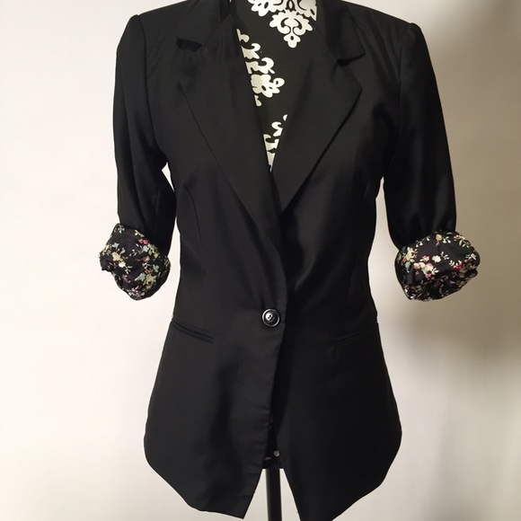Black blazer with floral lining.