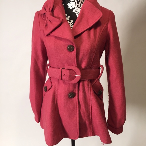 Adorable pink coat with bows.