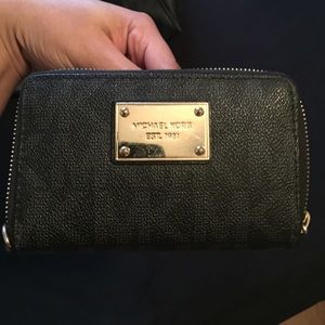 Michael Kors gold and black wallet . Small