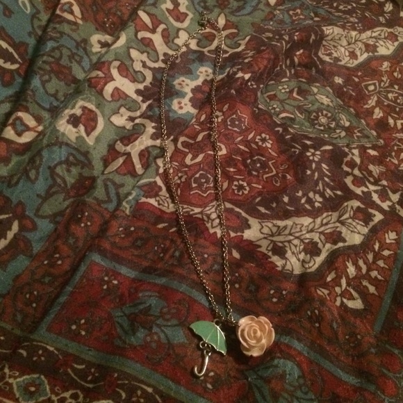 Rose and umbrella necklace.