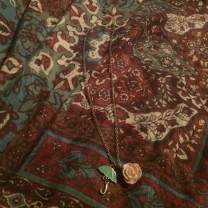Rose and umbrella necklace.