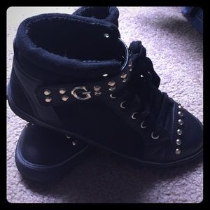 Black and gold guess high tops