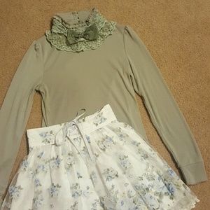 Lacy turtleneck with bow accent