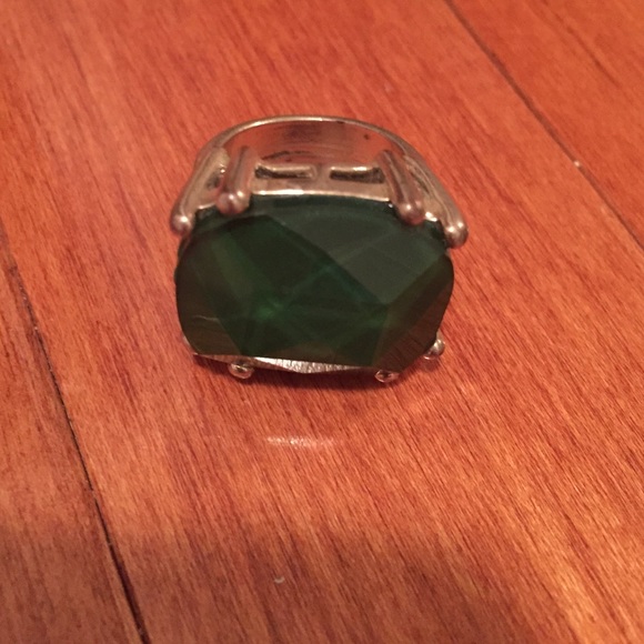 Gorgeous gold cocktail with green stone