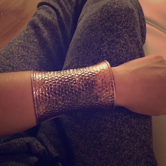 Bronze copper embossed wrist cuff.