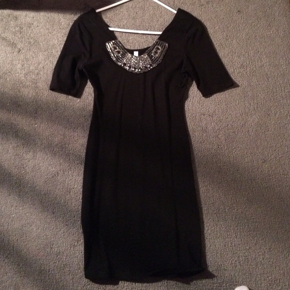 Tight black dress with beading accent