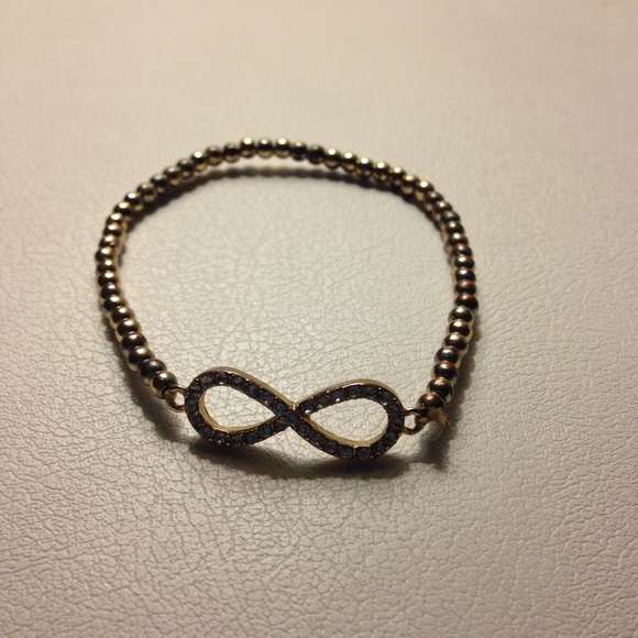 Gold beaded infinity symbol bracelet.