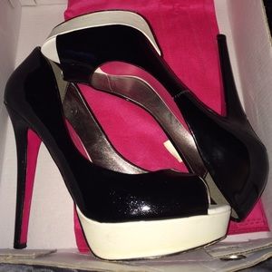 Black white and pink pumps