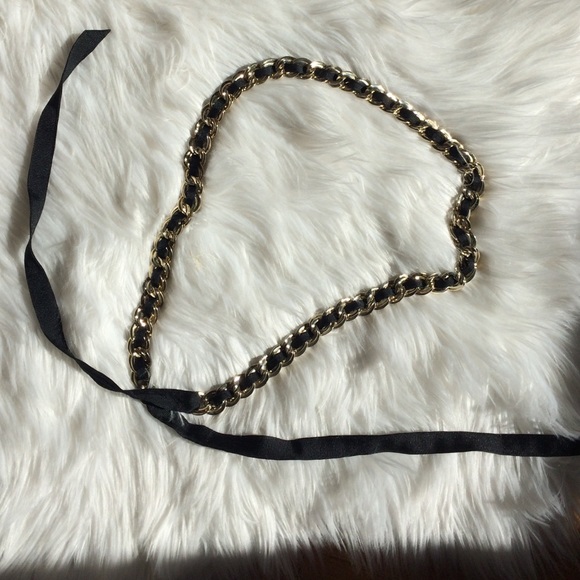 Gold chain and black ribbon belt