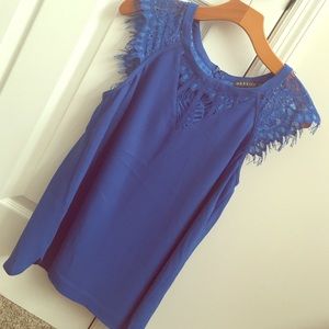 Cobalt tank with lace cap sleeve .