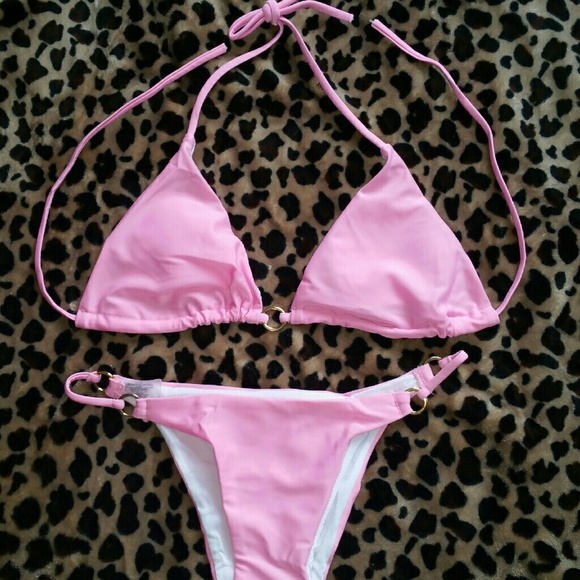 Pink two piece bathing suit with gold accents