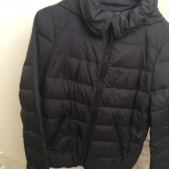 Black puffy jacket with a hidable hood