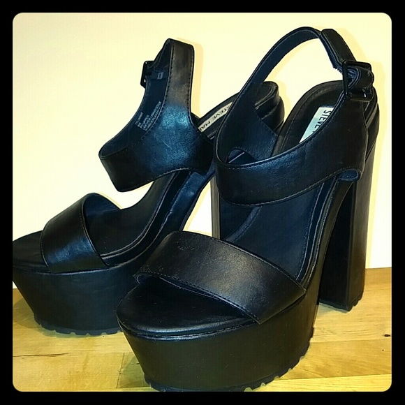 Steve Madden. Black platforms with tread.
