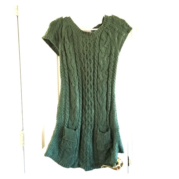 Green sweater dress with pockets.