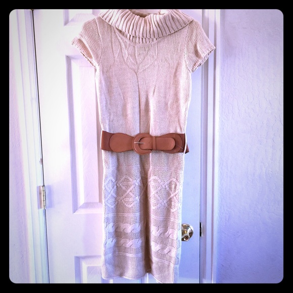 Cream dress sweater with tan belt.