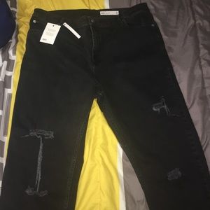 Distressed plus size boyfriend jeans.