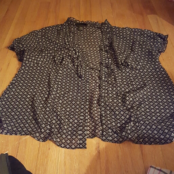 Lane Bryant black top with grey and white design.