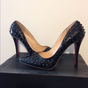 Red bottom spiked heels