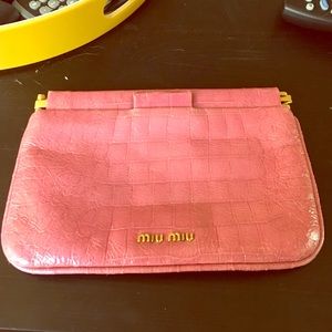 Miu Miu pink clutch.