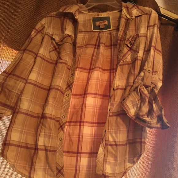 Purple flannel button up shirt.