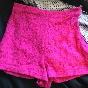 High waisted pink floral textured shorts.
