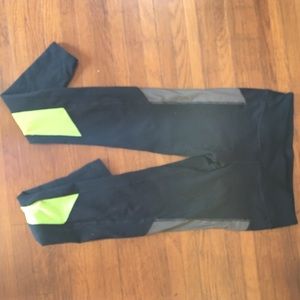 Black alo yoga pants with neon stripe