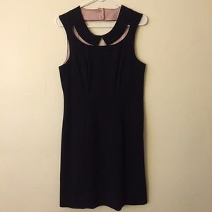 Black sheath dress with cut out collar.