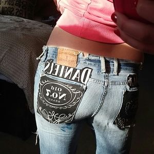 Extremely distressed jack daniels lucky jeans