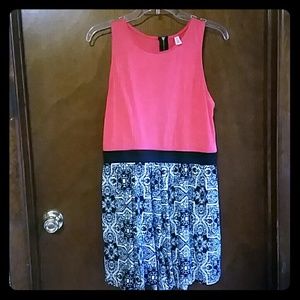 Salmon, black, and white romper.