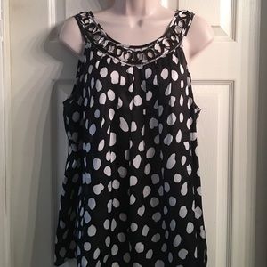 Fun and flirty sleeveless polka dot top