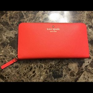 New with out tags Kate Spade zip orange wallet