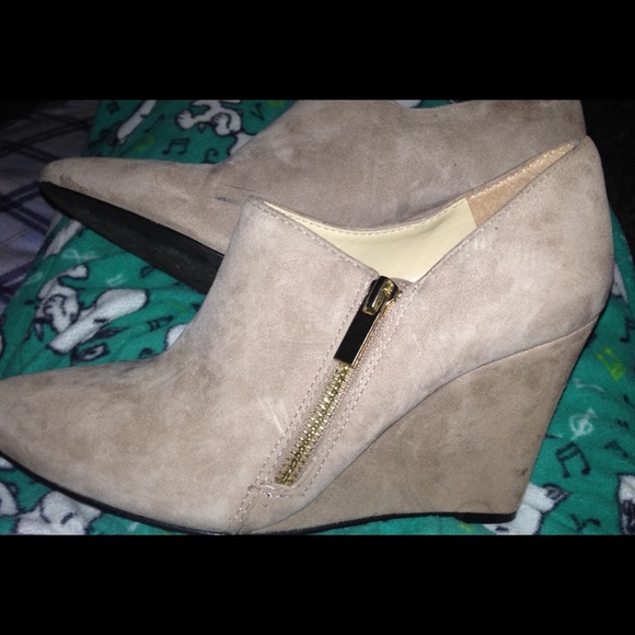 Tan suede wedges .