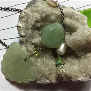 Unusual stone pendant with pearl