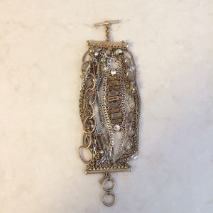 Multi chain gold and silver tone bracelet