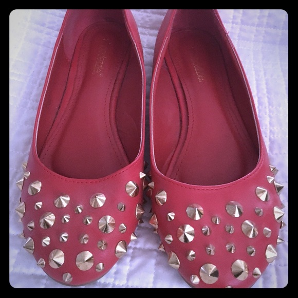 Red flats with gold stud detailing. Size 9
