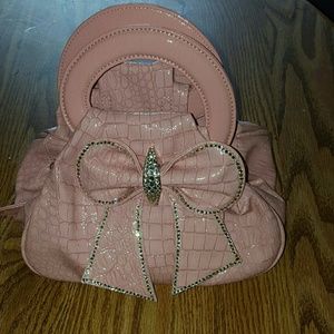 pink purse/clutch with rhinestone accented bow