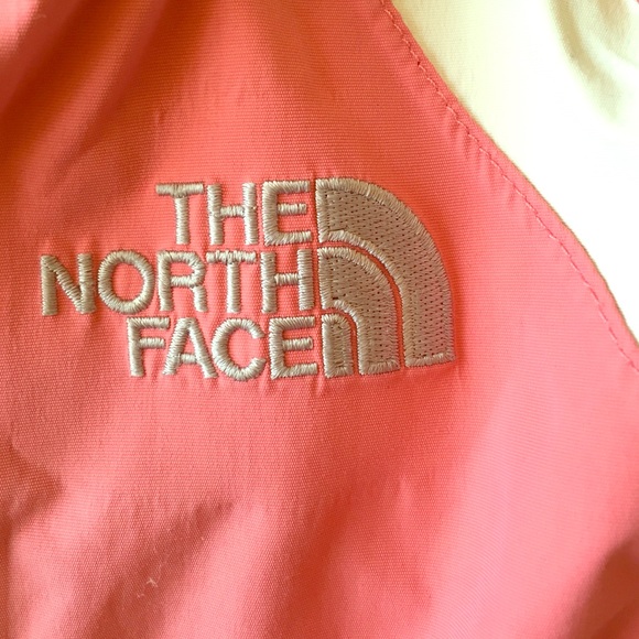 Pink and white Northface rain jacket