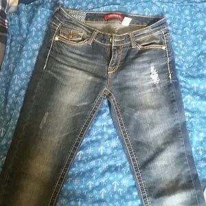 Distressed straight leg jeans.