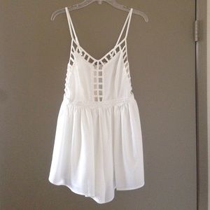 NWT white romper with cage and flower detail