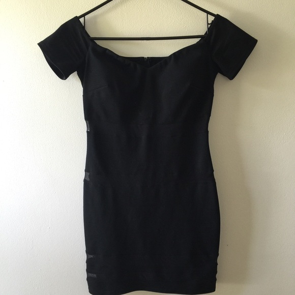 Black cock tail dress. Parts are see though