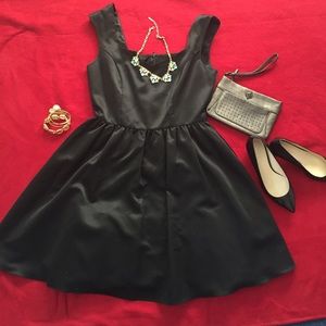 Black dress with scalloped neckline