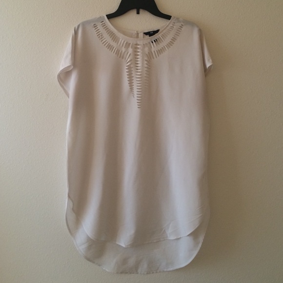 Long white polyester tunic with laser cut details