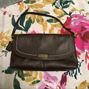 Authentic coach brown leather clutch.
