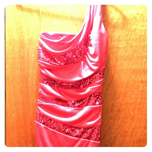A pink dress with pink sequin stripes. Never worn