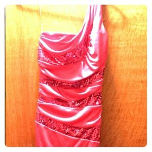 A pink dress with pink sequin stripes. Never worn