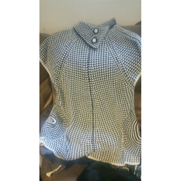 Black and white knit top with button collar