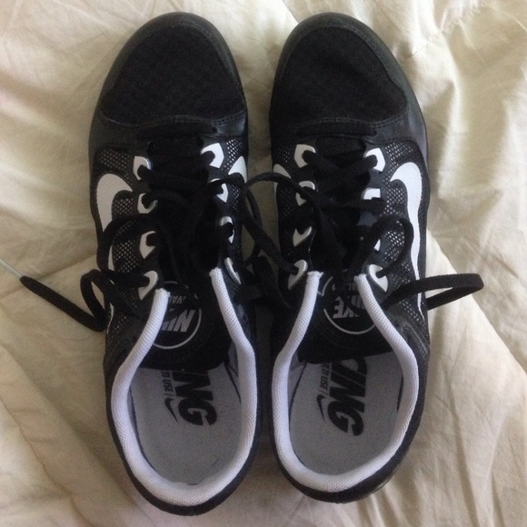 Black + white nike rival md multi use track shoes