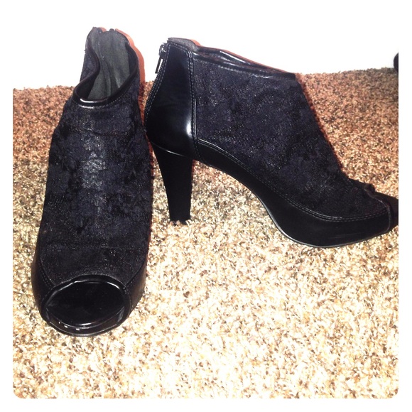 Black ankle heels with subtle lace and toe hole.